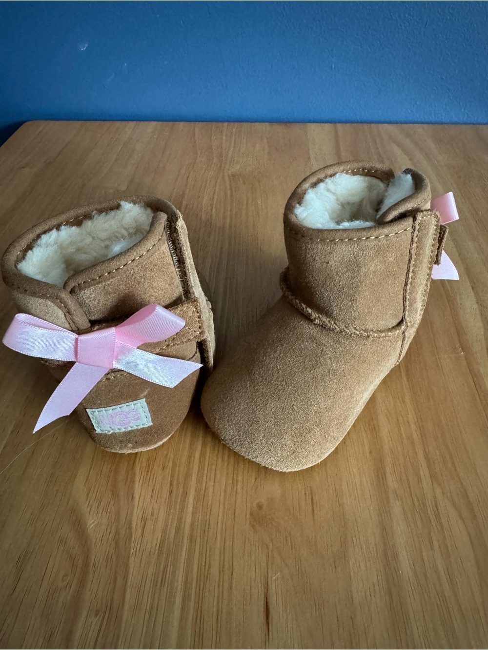 Cozy Brown Faux-Suede UGG Baby Boots with Pink Bow
